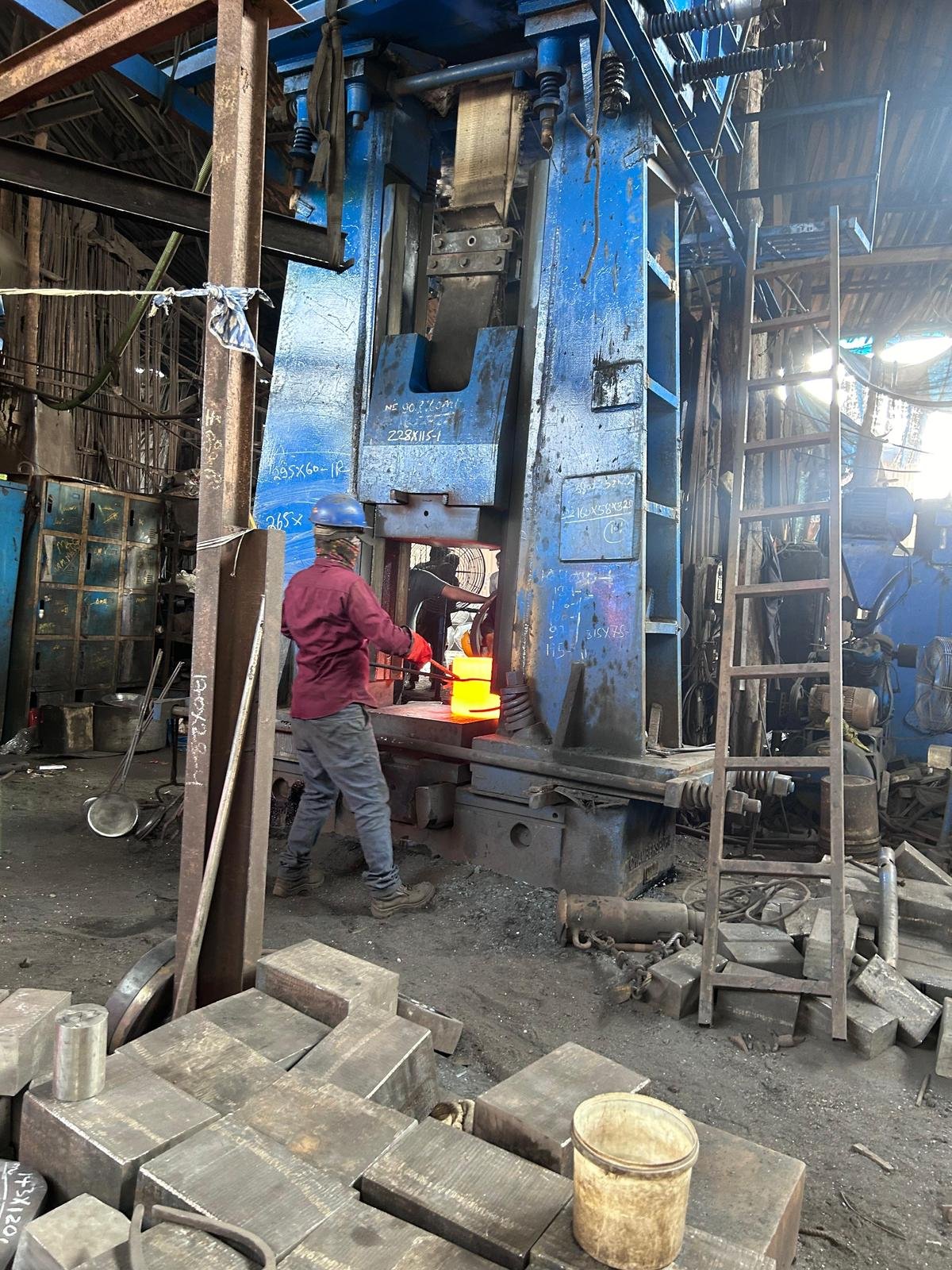 Hot forging press in operation at the JPS Metal & Alloys forging shop
